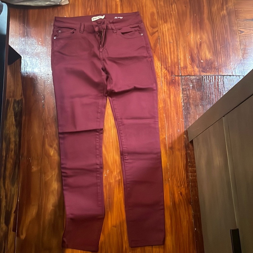 Never worn, size 27. Red wine color mid rise jeans